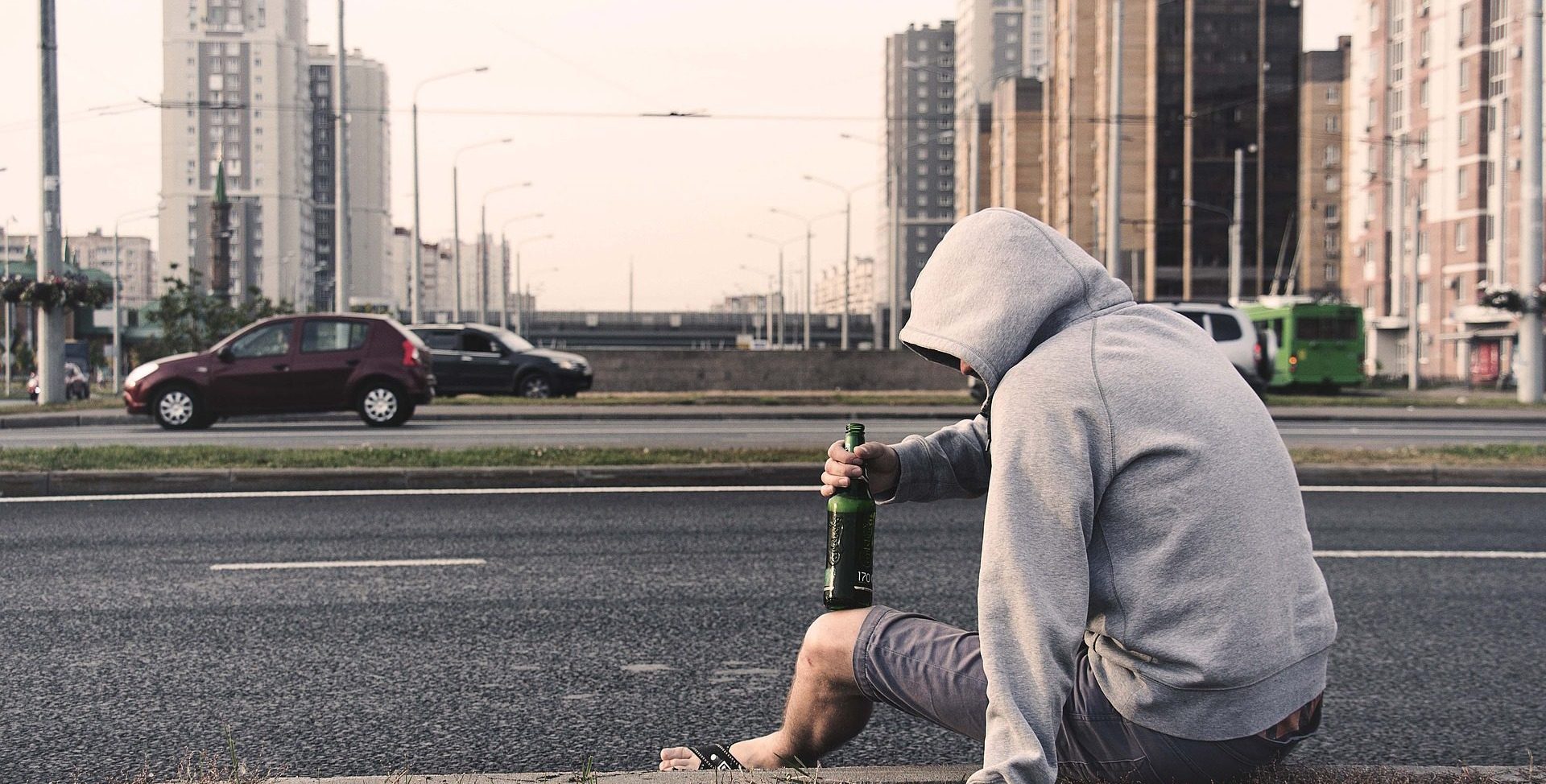 Image of man drinking alcohol on the street