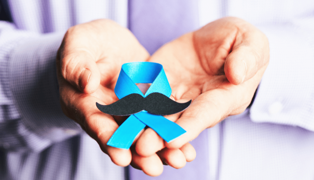 Man holding blue ribbon with mustache